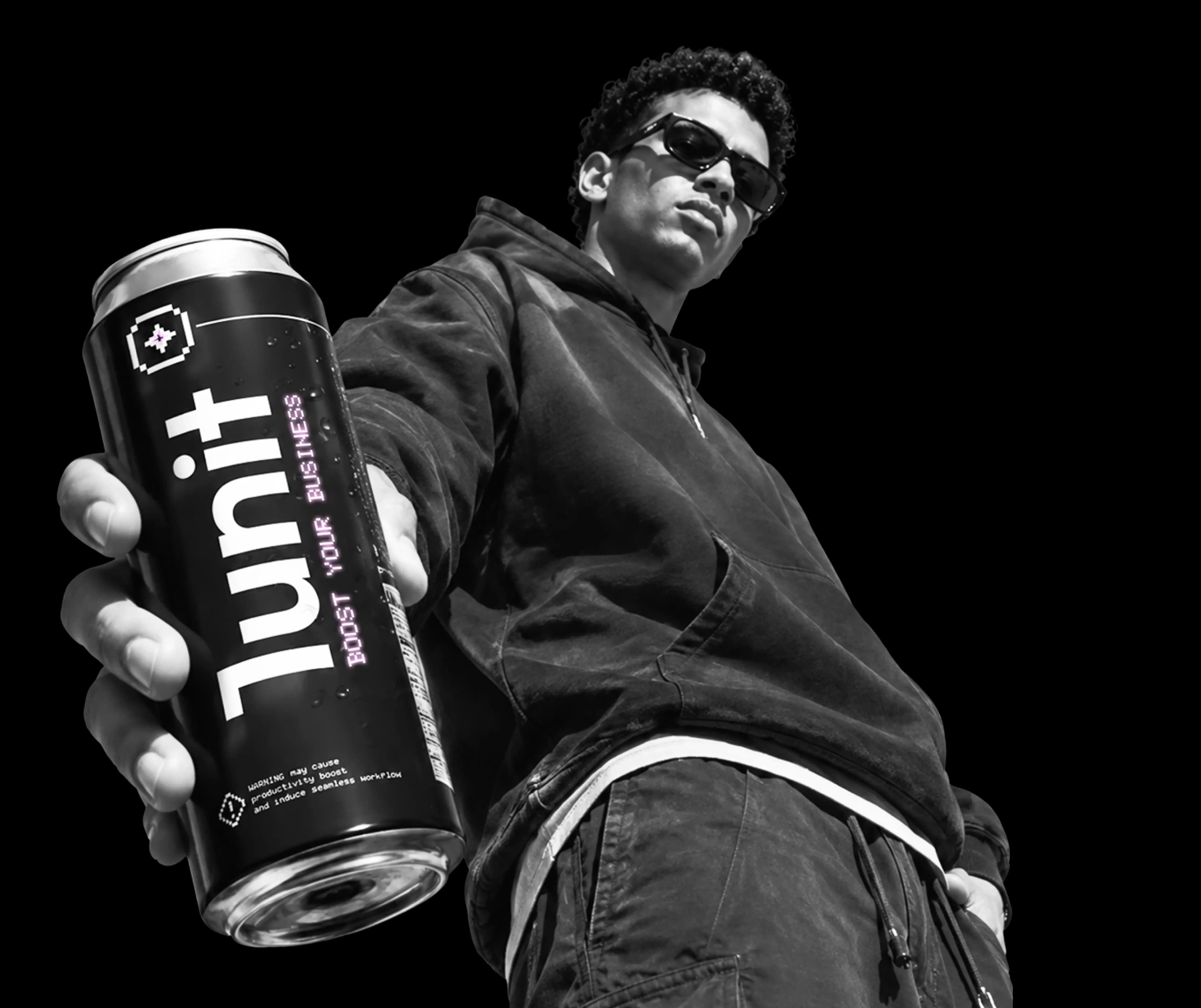 Founding member wearing the 1Unit hoodie and holding a 1Unit can